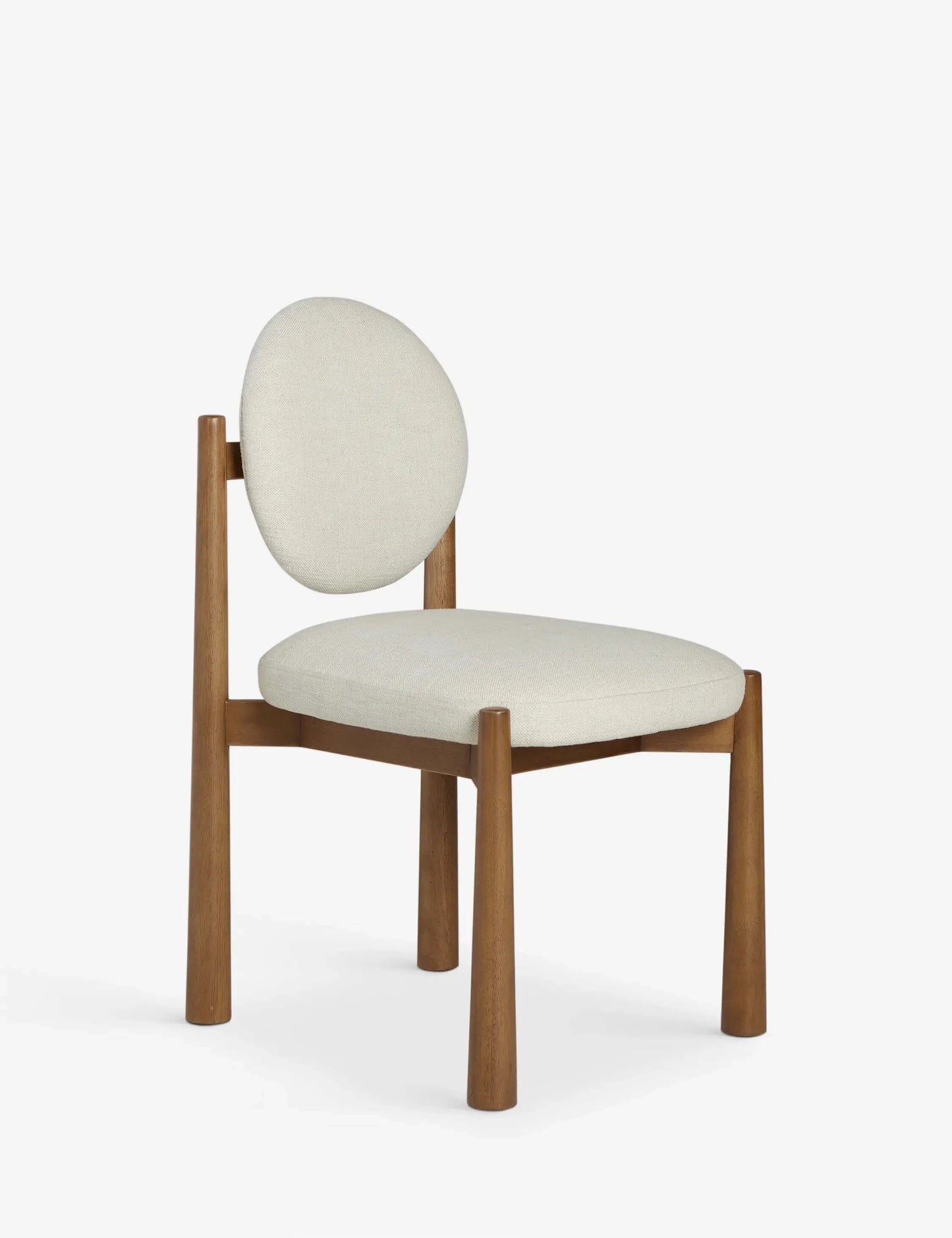 Side profile of the Badr Dining Chair showcasing its clean lines and natural wood frame.