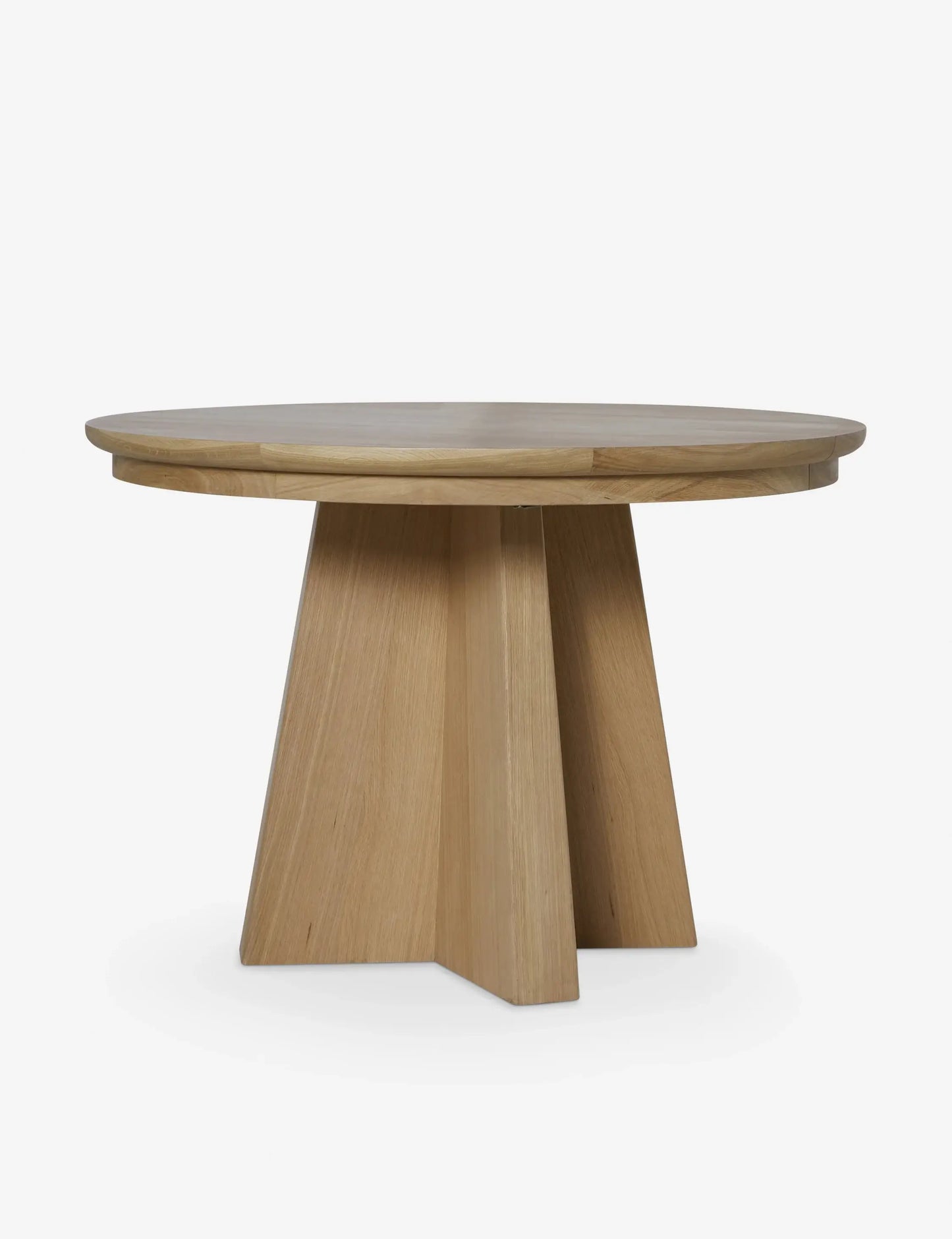 Round Ghareeb extendable dining table in a beautifully styled dining space, ideal for modern and luxury homes in the UAE.