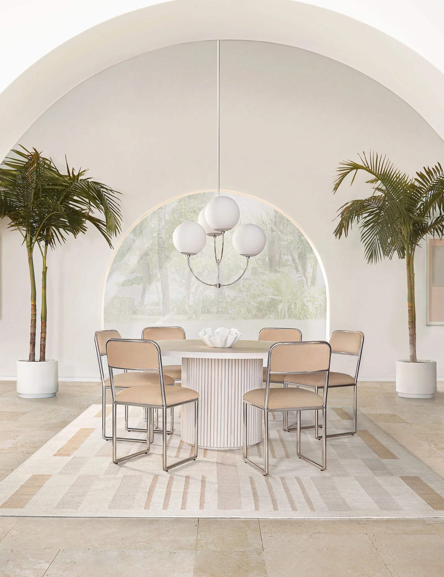Contemporary dining room setup featuring the Meis round acacia dining table.