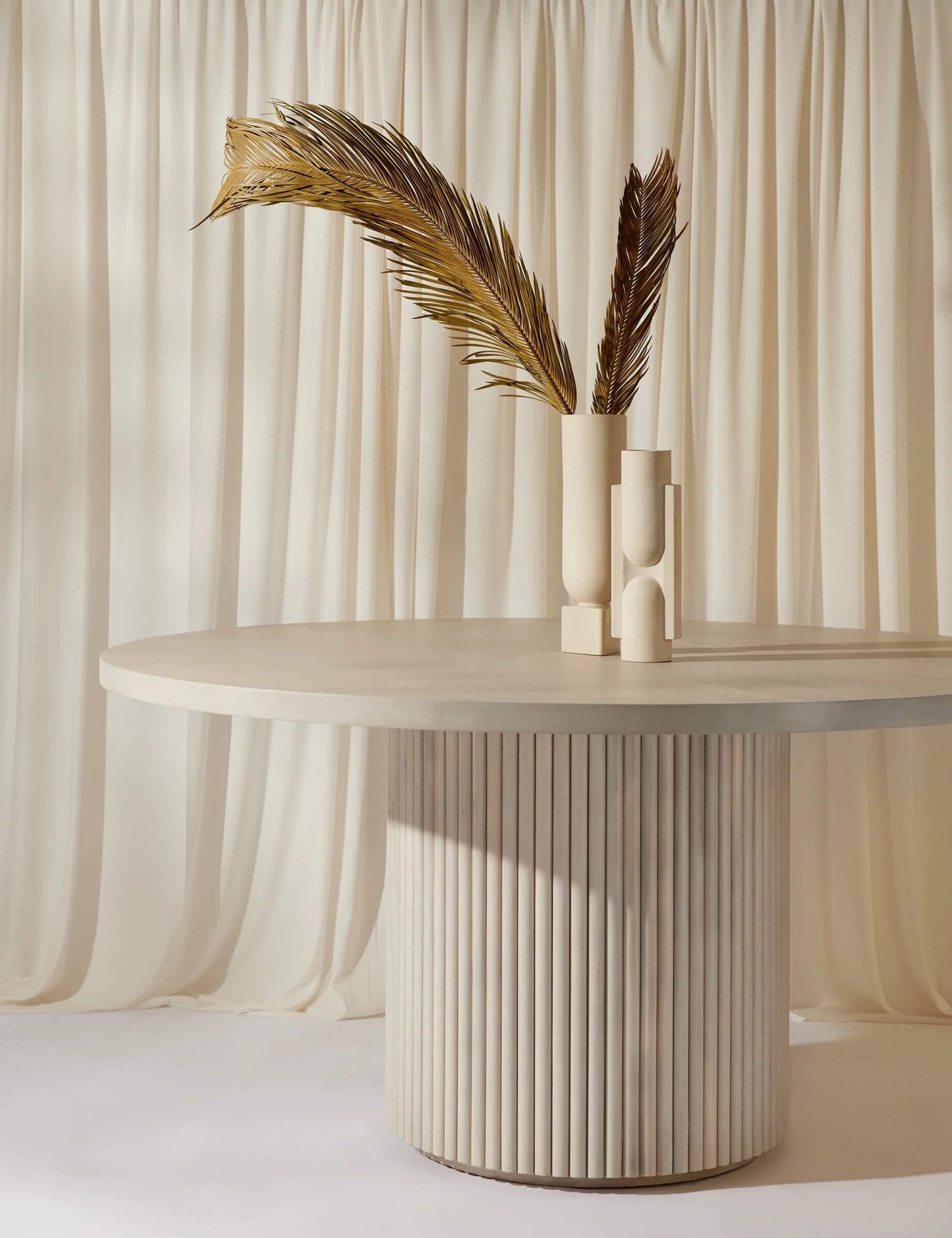 Organic modern interior with the Meis fluted base dining table.