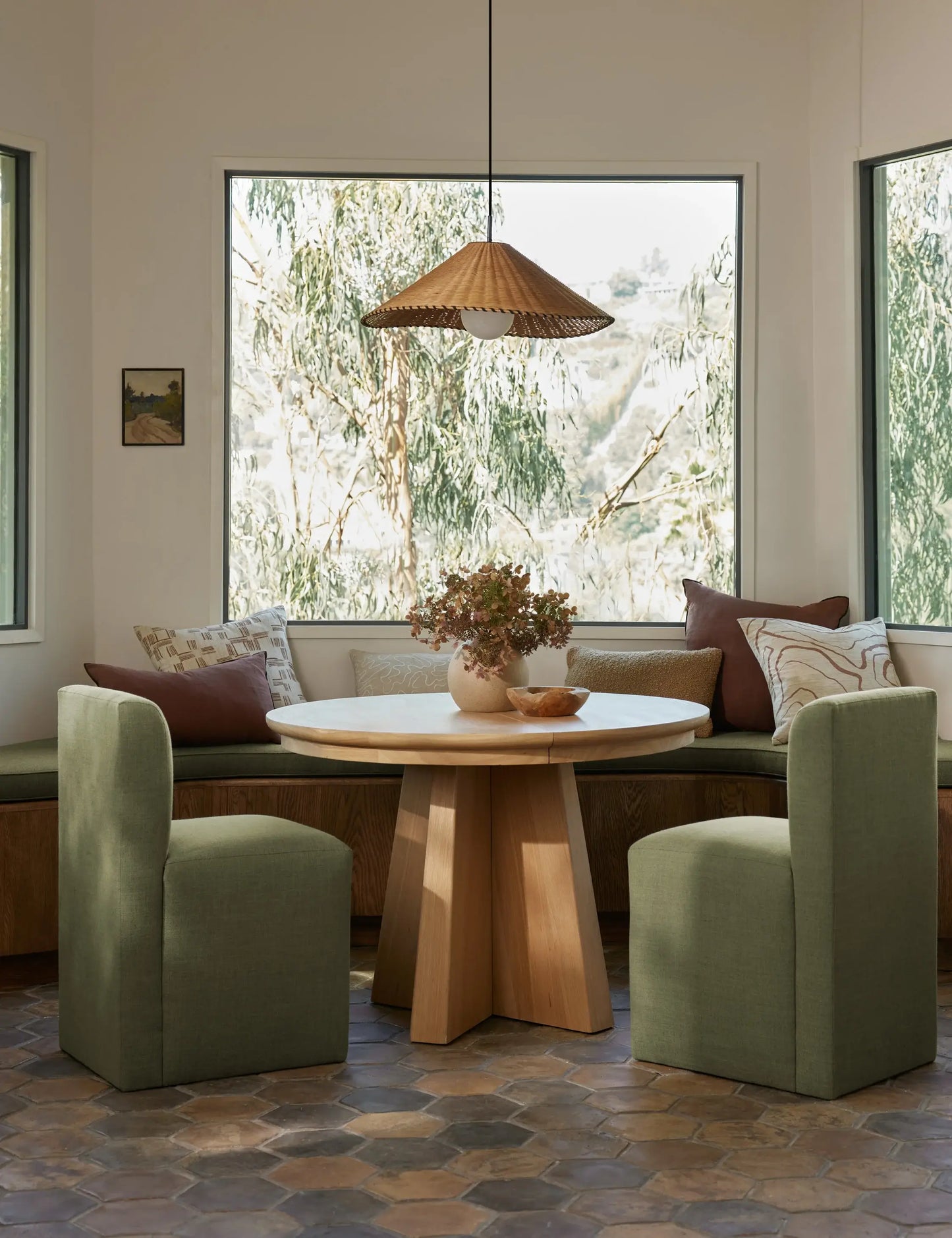 Round Ghareeb extendable dining table in a beautifully styled dining space, ideal for modern and luxury homes in the UAE.
