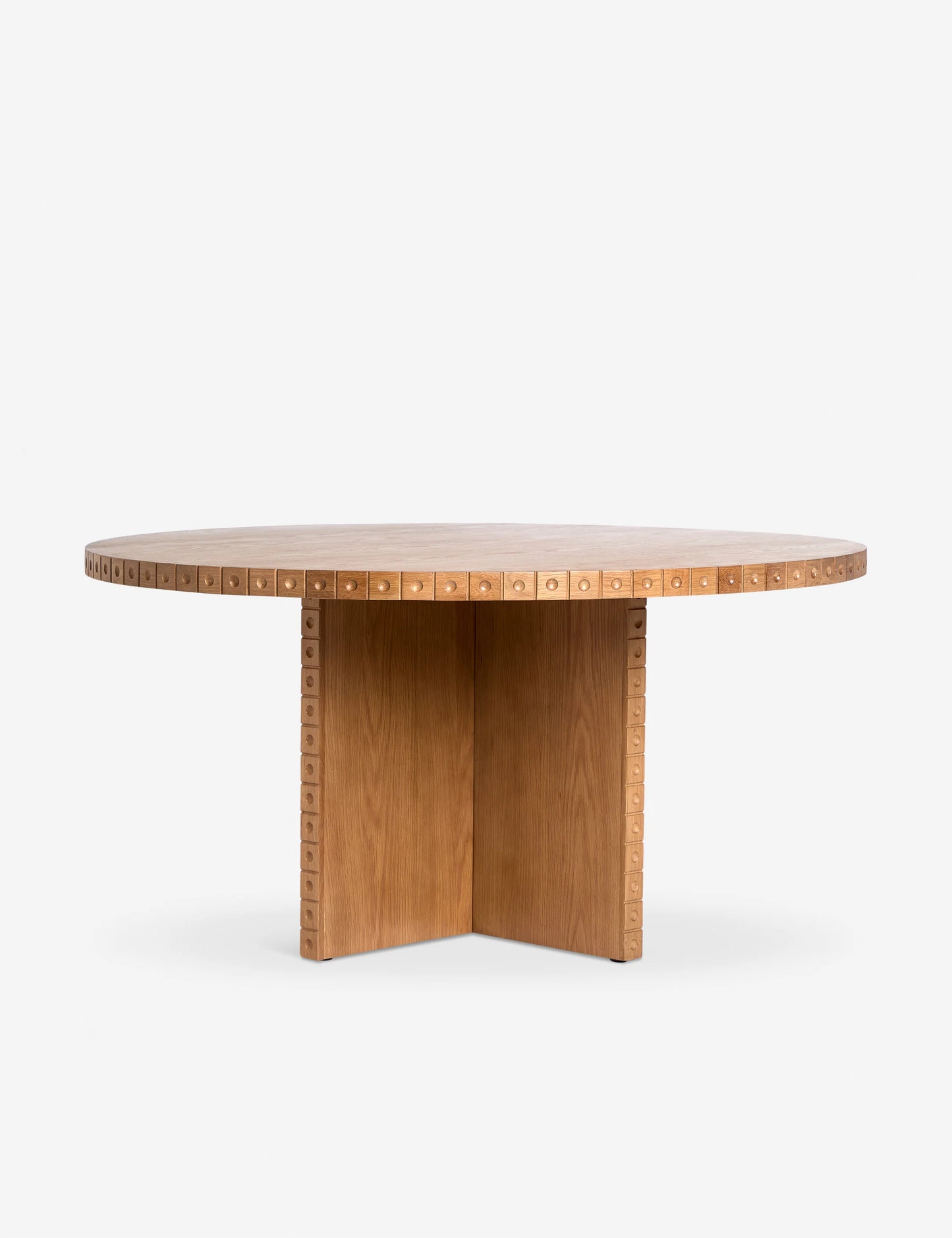 نور Nour Round Dining Table, a handcrafted solid oak dining table with sculptural dot trim detailing, designed for modern interiors.