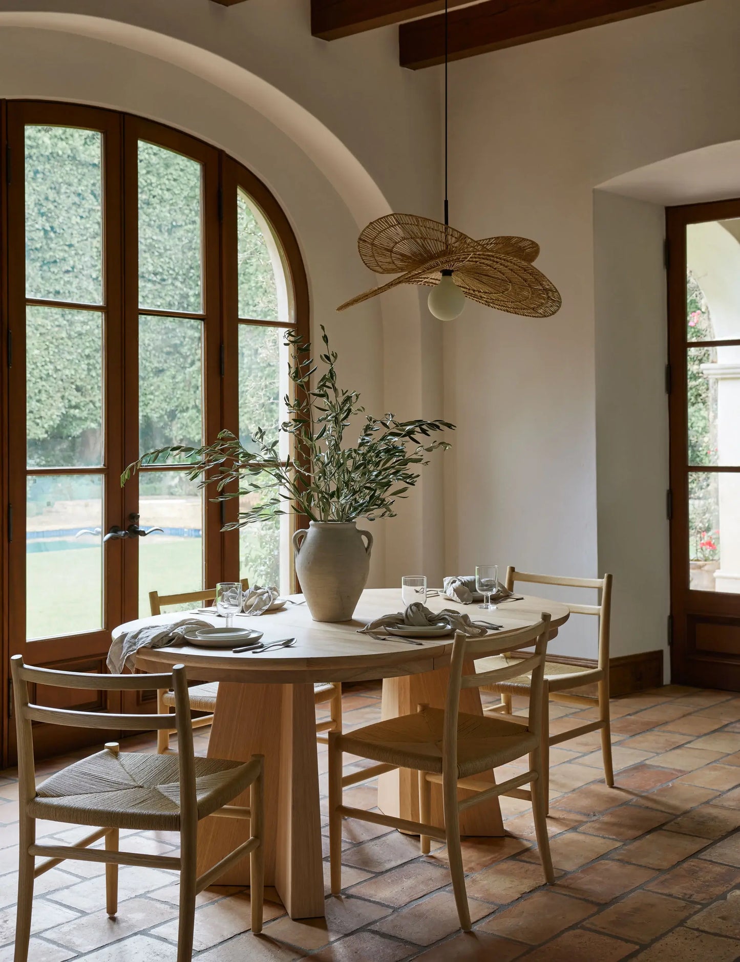 Ghareeb oval extendable dining table styled in a contemporary home, showing its spacious six-seater transformation.