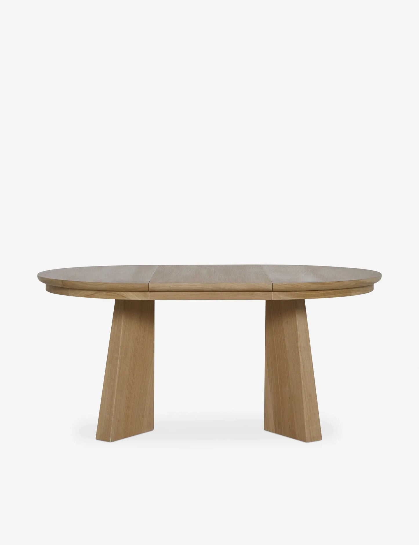 Sculptural cross-pedestal base of the Ghareeb dining table in its round form, designed for stability and modern appeal.