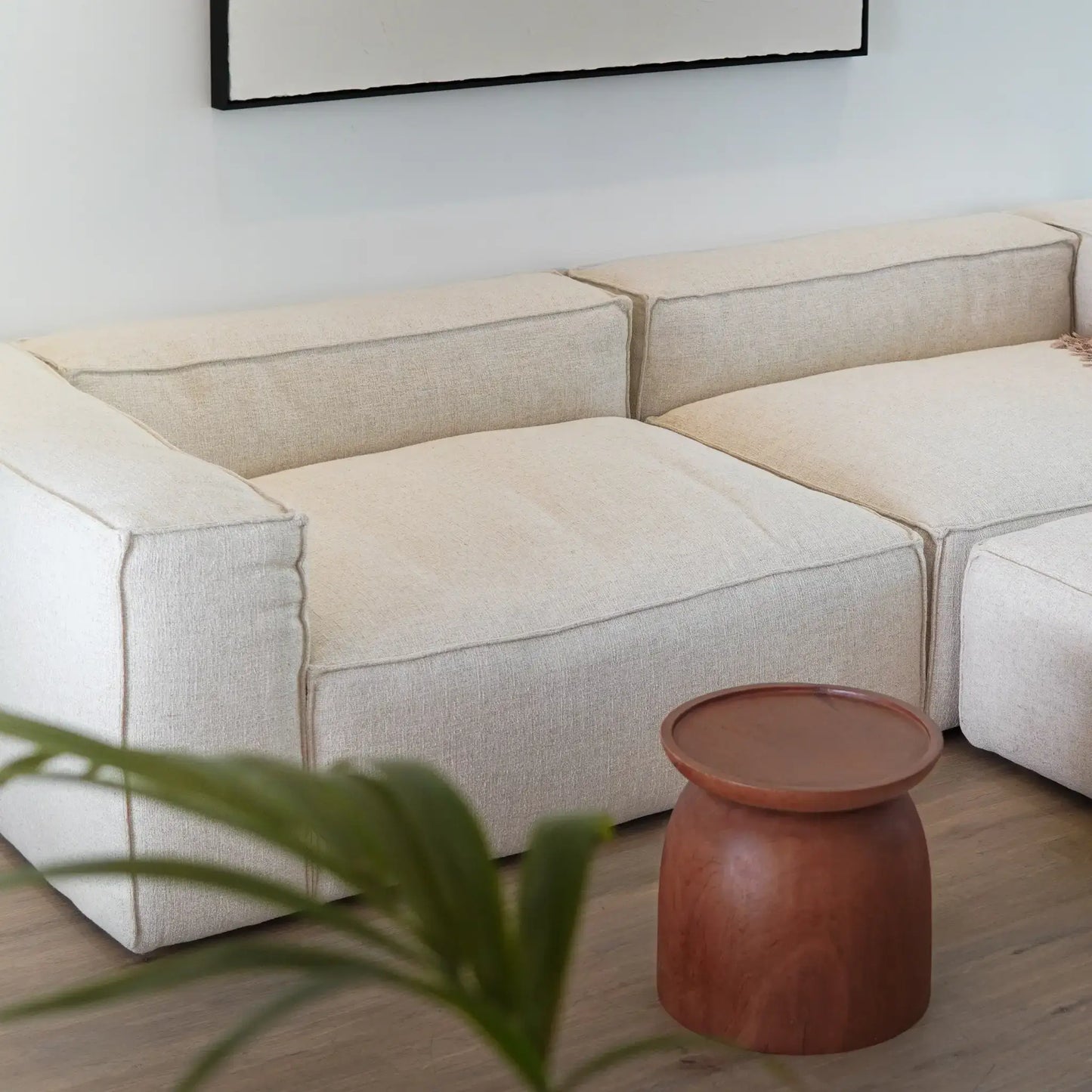 Luxury Kawkab Nest Table made from solid teak, featuring smooth, rounded edges reminiscent of orbiting planets. A perfect addition to a Wabi-Sabi aesthetic.