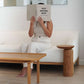 Sculptural wooden side table, Aża, blending natural textures with mindful living.