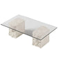 Hand-carved limestone coffee table featuring raw stone texture and a spacious glass surface, perfect for contemporary homes in the UAE.
